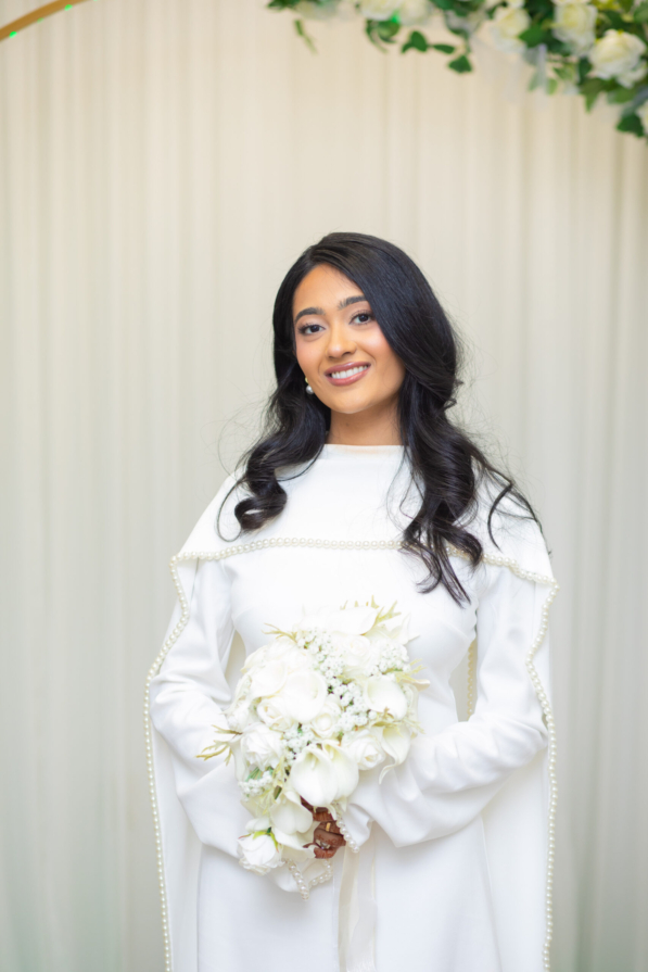 Candid wedding portrait of a bride and groom smiling at each other during a ceremony in Tampa FL by imkashi Photography