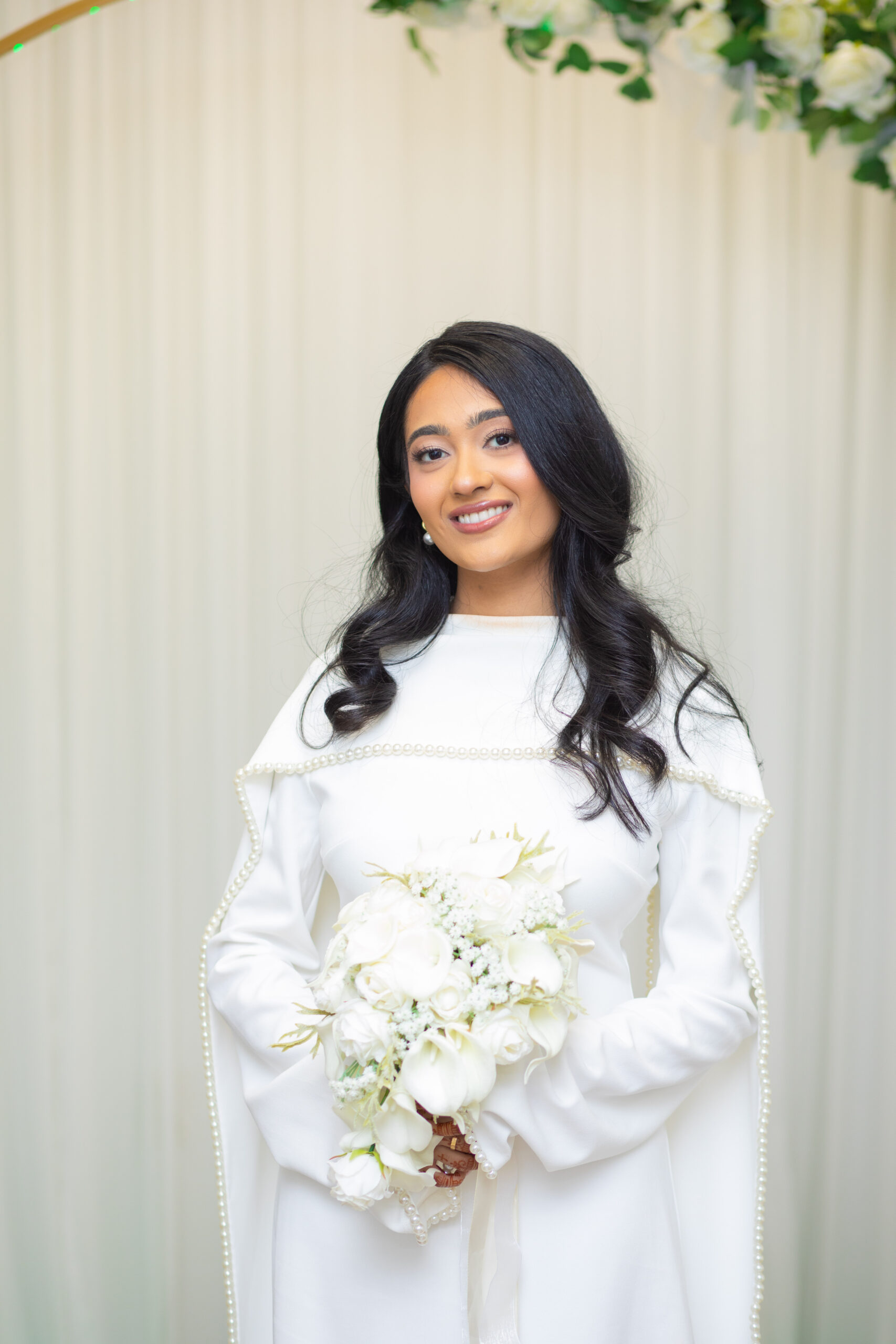 Candid wedding portrait of a bride and groom smiling at each other during a ceremony in Tampa FL by imkashi Photography