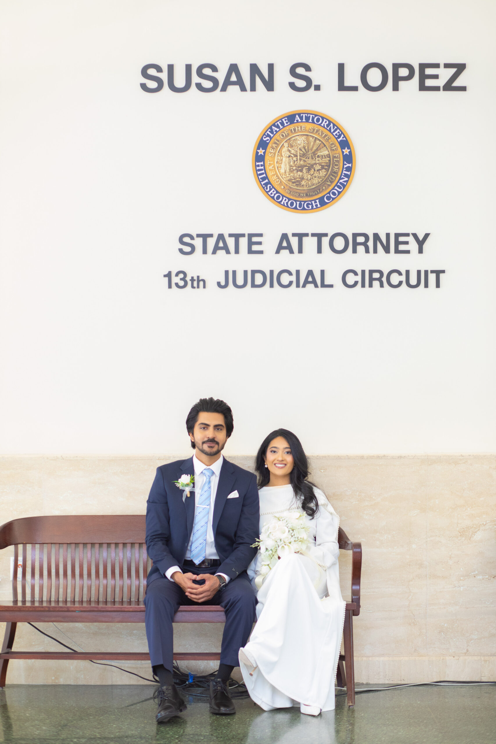 Candid wedding portrait of a bride and groom smiling at each other during a ceremony in Tampa FL by imkashi Photography