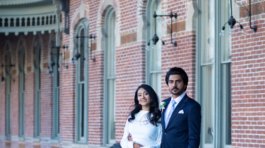A bride and groom posing for romantic wedding portraits in downtown Tampa near the courthouse squares with city architecture backgrounds by imkashi Photography