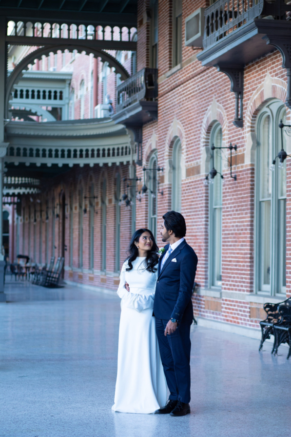 Candid moment of a bride and groom laughing during a wedding reception in Tampa FL