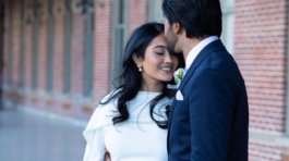 A bride and groom posing for romantic wedding portraits in downtown Tampa near the courthouse squares with city architecture backgrounds by imkashi Photography