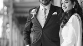 A bride and groom posing for romantic wedding portraits in downtown Tampa near the courthouse squares with city architecture backgrounds by imkashi Photography